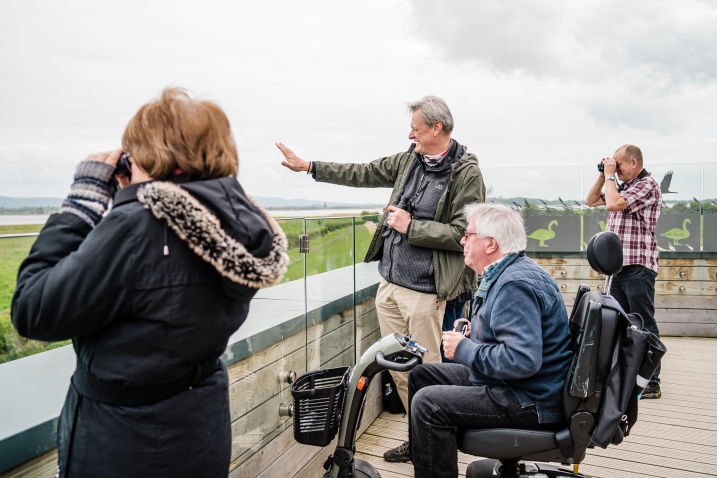 Visitors on roof terrace of Accessible Estuary Tower Hide at WWT Slimbridge Wetland Centre. Credit WWT and Clem Stevens .jpg